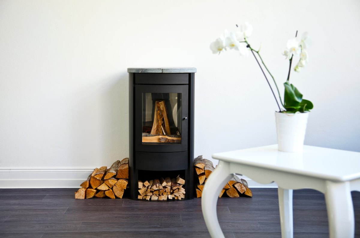 Stacked firewood stored away from the home and the wood stove
